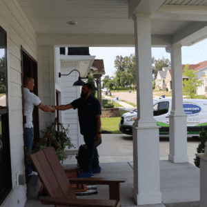 hvac services hazelwood mo technician shaking customers' hands
